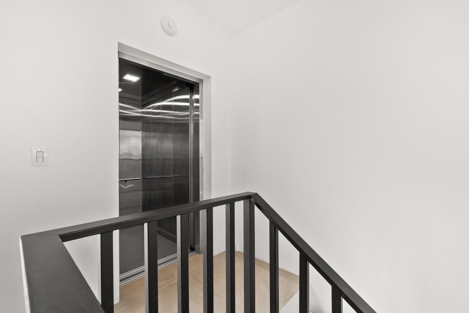 The private elevator at Casa Nina Flamingo, seen from the stair landing